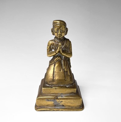 Lot 1050 - An Indian brass figure of a priest, probably...