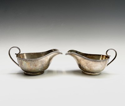 Lot 37 - A pair of George V silver sauce boats by...