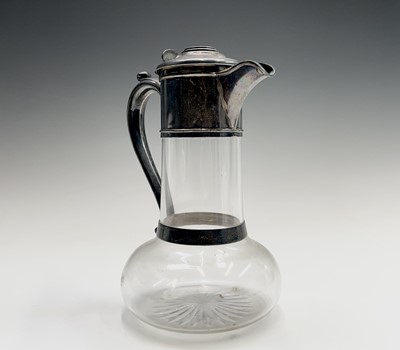 Lot 41 - A late Victorian silver mounted claret jug by...