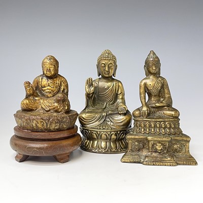 Lot 289 - A gilt bronze small figure of a seated Buddha,...