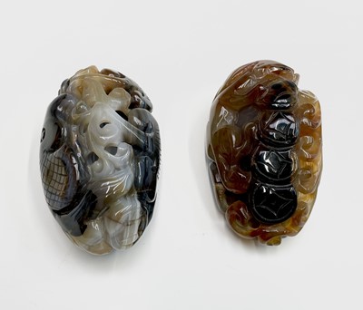 Lot 295 - A Chinese agate pebble, carved with a fish and...