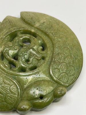 Lot 303 - A Chinese jade carved disc, 20th century,...