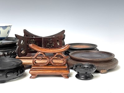 Lot 309 - A collection of Chinese hardwood stands,...