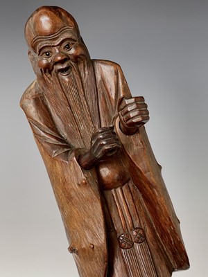 Lot 311 - A Chinese hardwood figure, carved as a bearded...