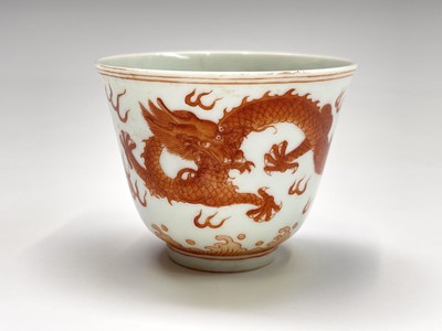 Lot 340 - A Chinese iron red dragon cup, Guangxu mark...