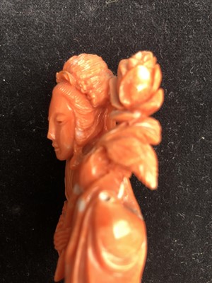 Lot 367 - A Chinese carved coral figure of Guanyin...