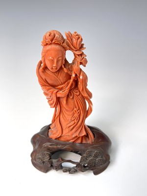 Lot 367 - A Chinese carved coral figure of Guanyin...
