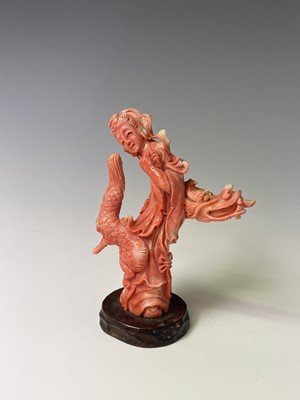 Lot 79 - A Chinese carved coral figure of Guanyin...
