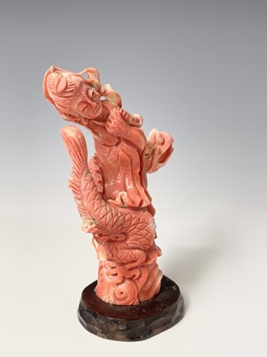 Lot 370 - A Chinese carved coral figure of Guanyin...