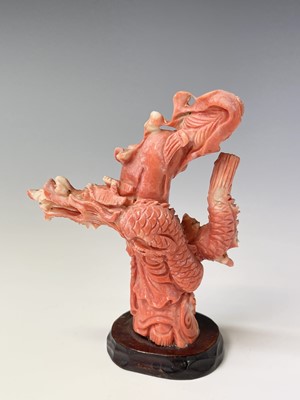 Lot 79 - A Chinese carved coral figure of Guanyin...