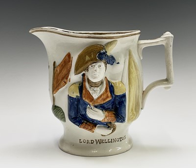 Lot 813 - A 19th century Staffordshire pottery jug,...
