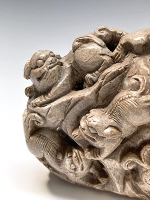 Lot 321 - A Chinese carved white stone group, circa 1900,...