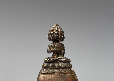 Lot 325 - A miniature bronze of a seated buddha,...