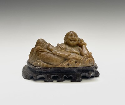 Lot 351 - A Chinese green stone figure of Buddha, 20th...