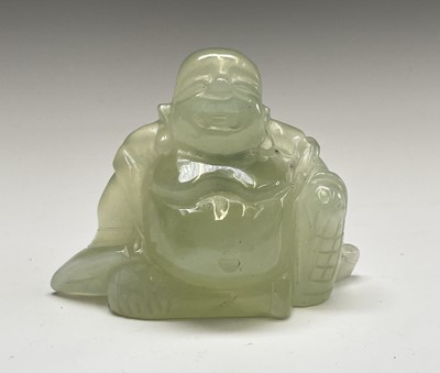Lot 351 - A Chinese green stone figure of Buddha, 20th...