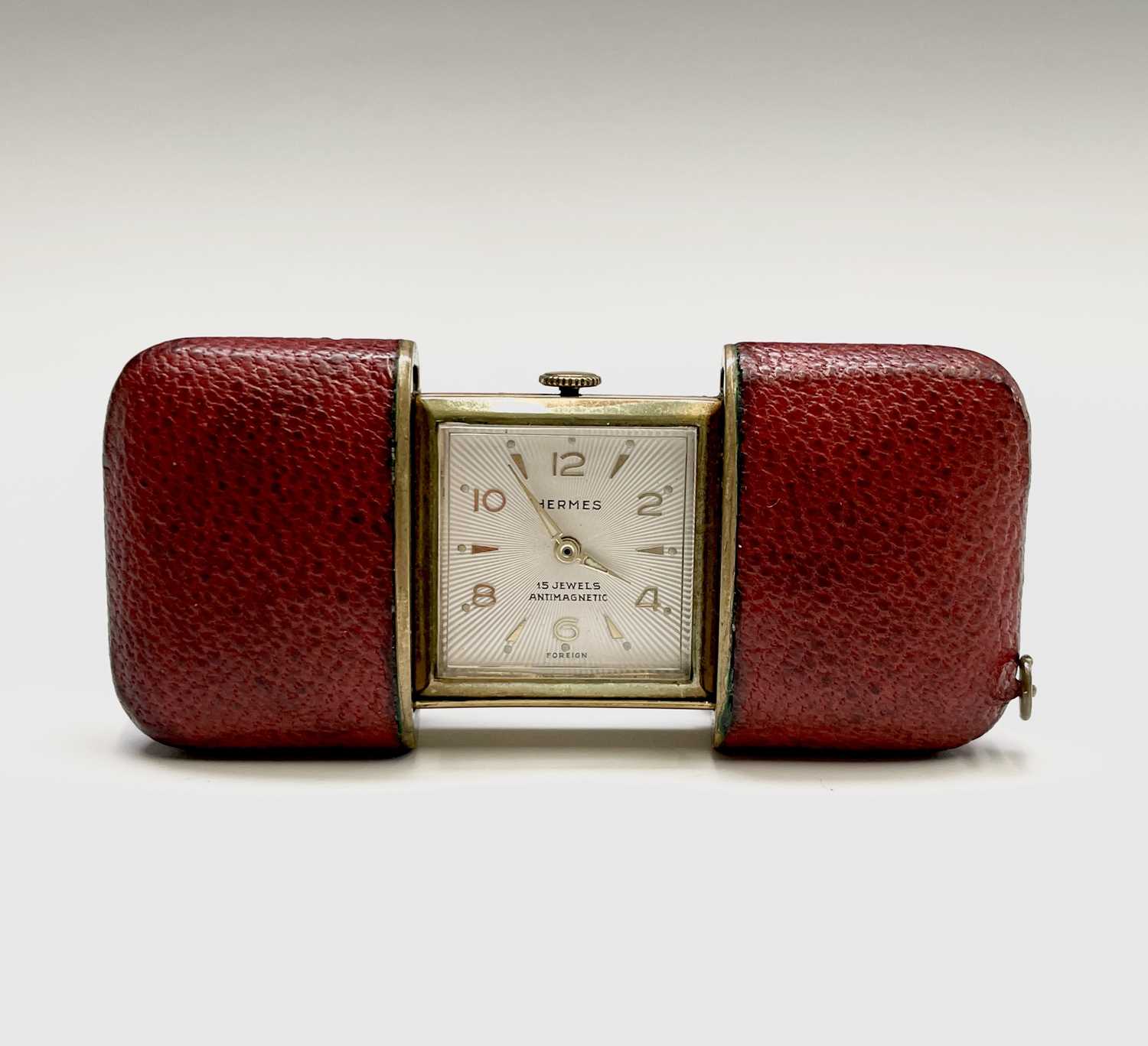 Lot 12 - A Hermes 15 jewel purse timepiece in gold...