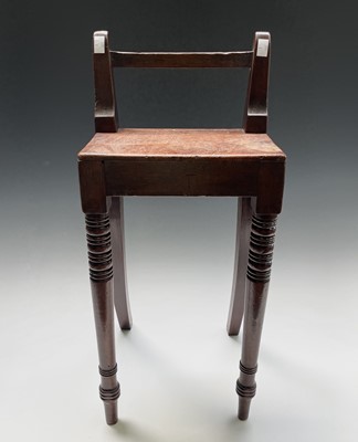 Lot 3168 - A Regency mahogany stool, with raised back and...