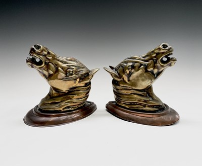 Lot 188 - A pair of brass horses' masks raised on copper...