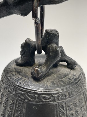 Lot 360 - A Chinese bronze dragon bell, early 20th...