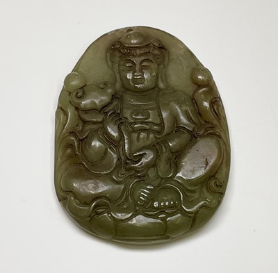 Lot 386 - A Chinese jade amulet, 20th century, carved...