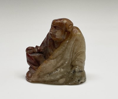 Lot 387 - A Chinese green stone seal, with a carved...