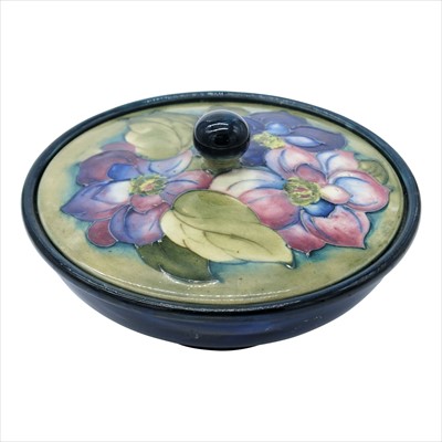 Lot 1354 - A Moorcroft 'Clematis' pattern bowl and cover,...