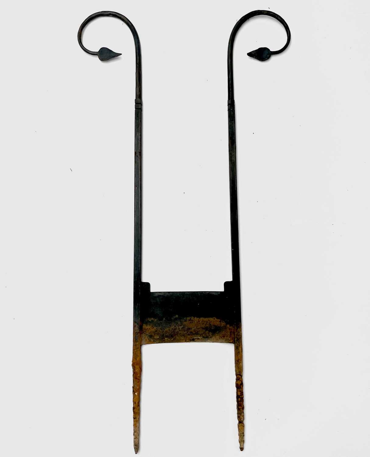 Lot 626 - A wrought iron boot scraper, in the Arts and...