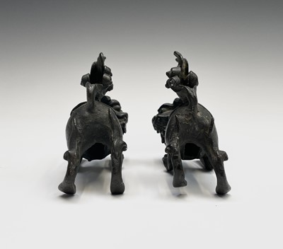 Lot 405 - Two similar Chinese bronze scroll weights,...