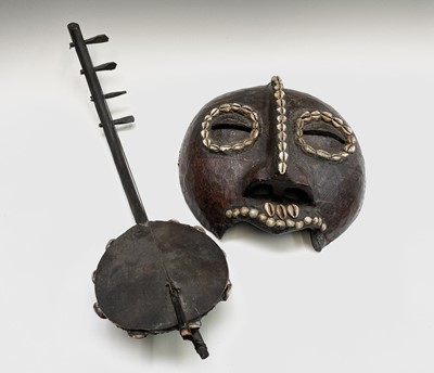 Lot 244 - A 19th century African tribal mask, with...