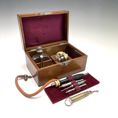 Lot 453 - A walnut cased cauterising set, probably...