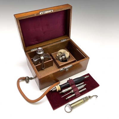 Lot 453 - A walnut cased cauterising set, probably...