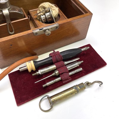 Lot 453 - A walnut cased cauterising set, probably...