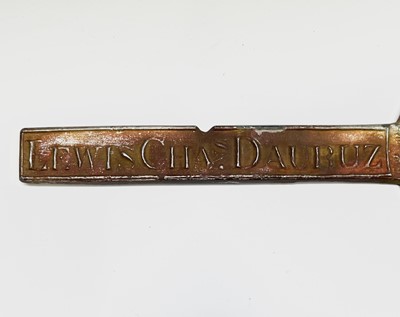 Lot 19 - A tin strap ingot reproduced from an old mould,...