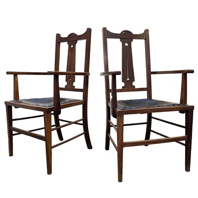 Lot 3045 - A pair of Arts and Crafts oak open armchairs,...