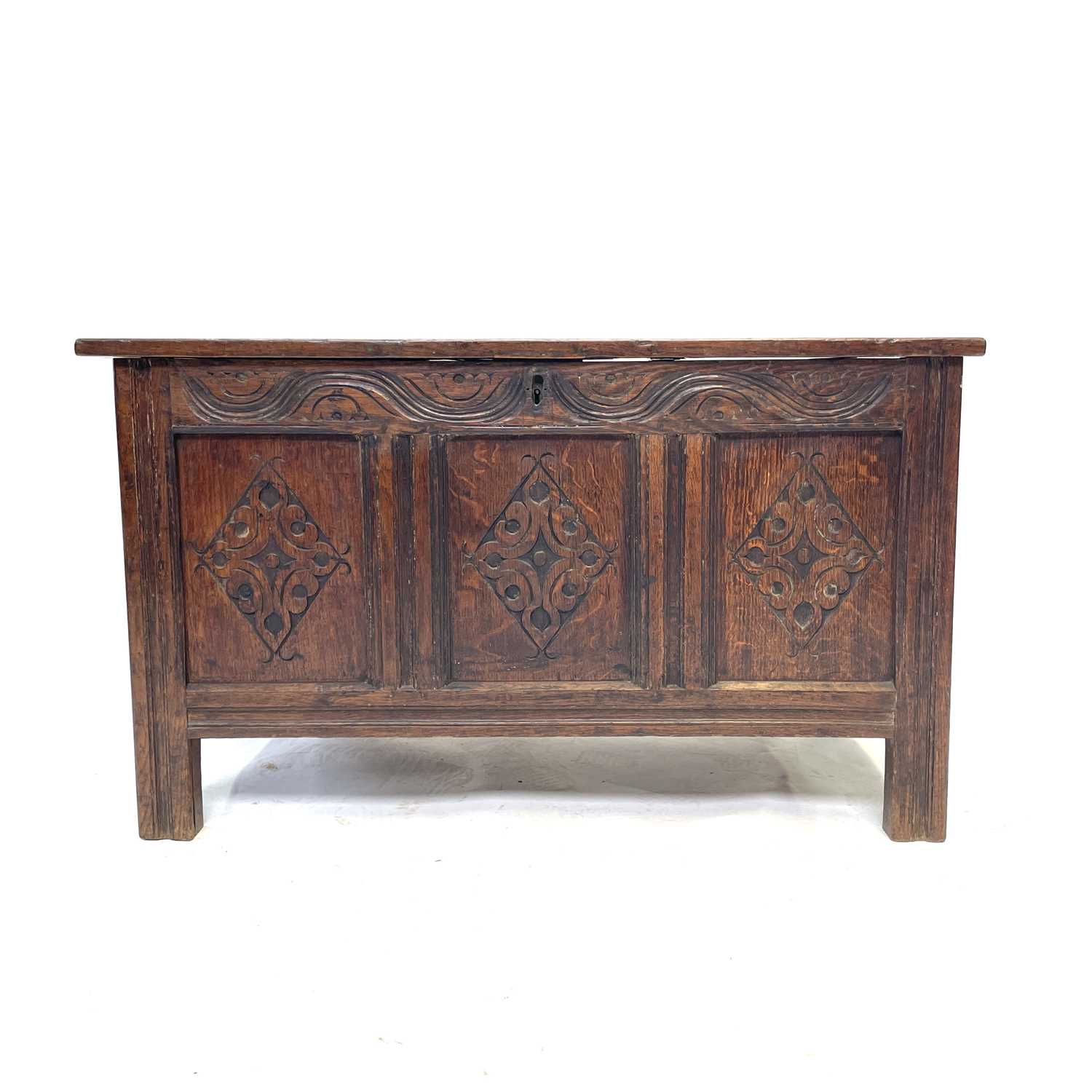 Lot 12 - A carved oak coffer, 17th/18th century, the...
