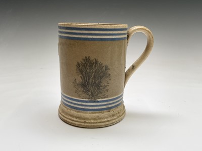 Lot 883 - A Victorian mocha ware pint mug, with applied...