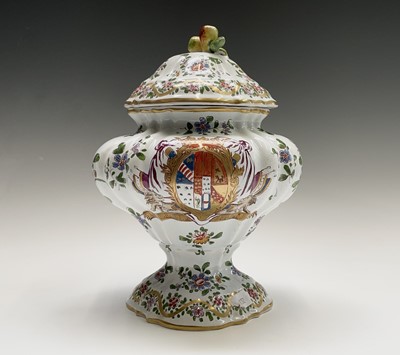 Lot 887 - An armorial tin glaze pottery jar and cover,...