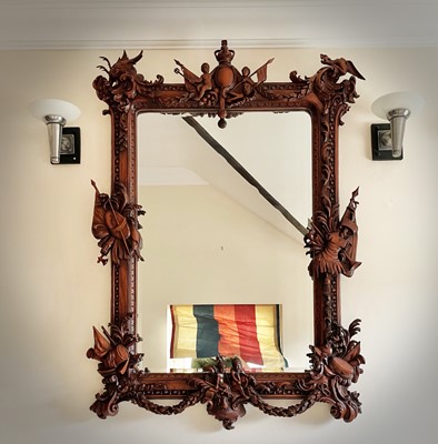 Lot 3143 - A mahogany ornate wall mirror, later 20th...