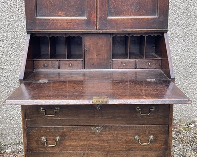 Lot 1 - A George III oak bureau bookcase, with a part...