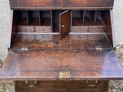 Lot 1 - A George III oak bureau bookcase, with a part...