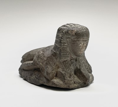 Lot 395 - An Egyptian carved stone sphinx headed scarab...