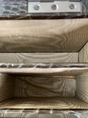Lot 417 - An Asprey crocodile hide covered stationery...