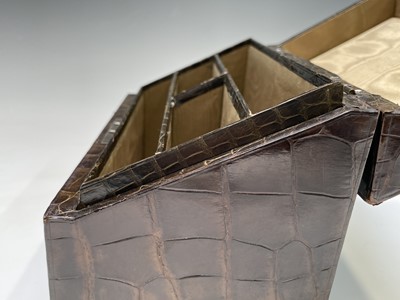 Lot 417 - An Asprey crocodile hide covered stationery...