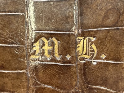 Lot 417 - An Asprey crocodile hide covered stationery...
