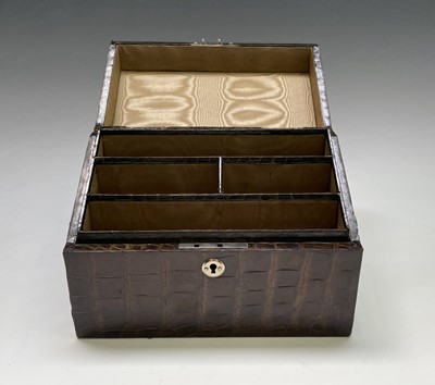 Lot 417 - An Asprey crocodile hide covered stationery...