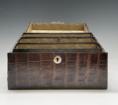 Lot 417 - An Asprey crocodile hide covered stationery...