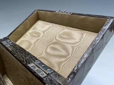 Lot 417 - An Asprey crocodile hide covered stationery...