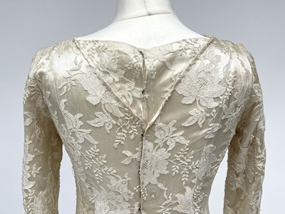 Lot 2812 - A 1950s wedding dress, duchess satin overlaid...