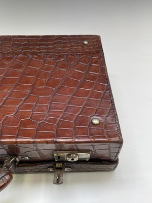 Lot 419 - An early 20th century crocodile skin briefcase...