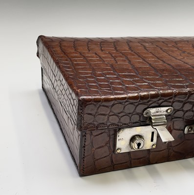 Lot 419 - An early 20th century crocodile skin briefcase...